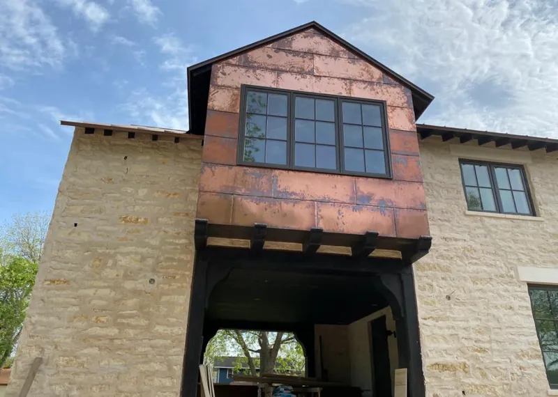 Copper metal panel facade on a stone building for Skylight Installation in Laguna Hills